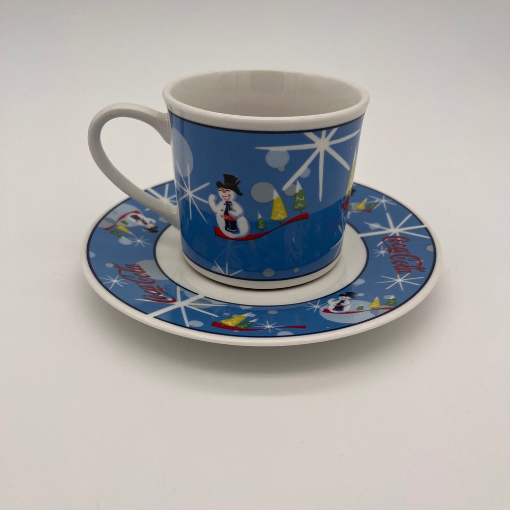 Coca-Cola Snowman Holiday Coffee Mug and Saucer Set Blue Winter Scene Ceramic
